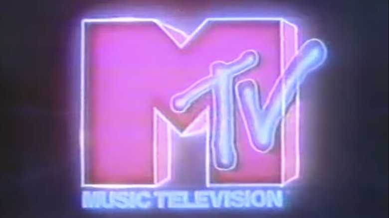 Neon pink and blue MTV logo on dark background