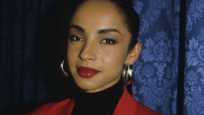 Sade Adu smiling and staring
