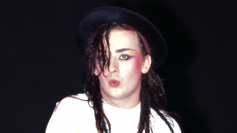 Boy George pursing lips on stage in the 1980s
