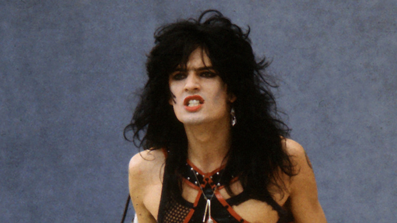Tommy Lee gritting teeth on stage in the 1980s