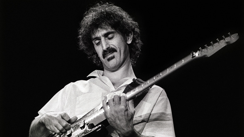 Frank Zappa playing guitar onstage