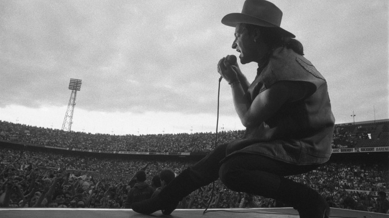 Bono performing in front of crowd