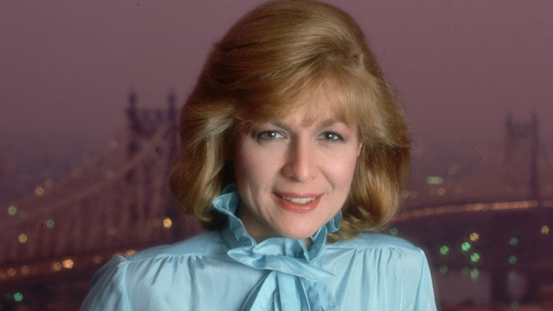 Jessica Savitch posing in front of city skyline