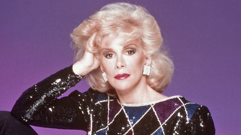 Joan Rivers with hand on hair in 1980s publicity photo