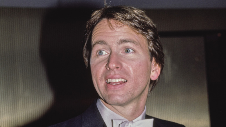 John Ritter smiling and looking off