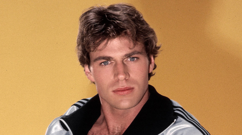 Jon-Erik Hexum modeling a track suit