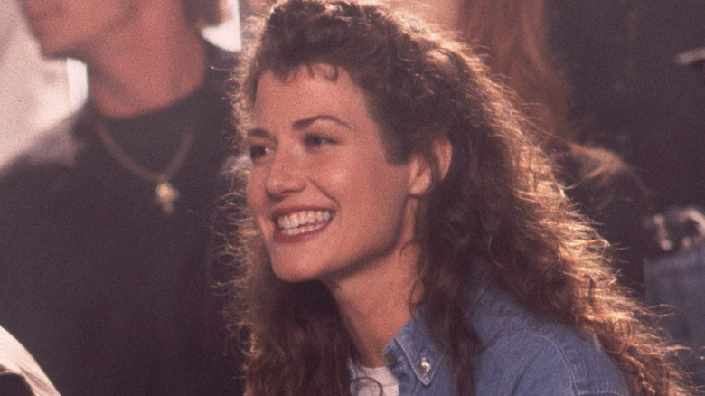 Amy Grant grinning on set of music video