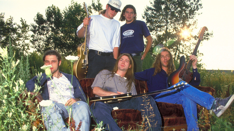 Collective Soul hangs out in a field with guitars