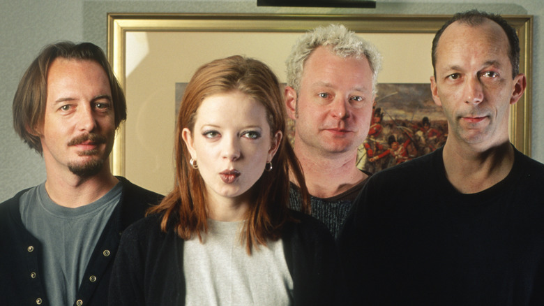 Garbage band members staring blankly into camera