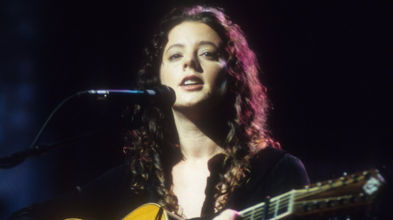 Sarah McLachlan plays guitar on stage