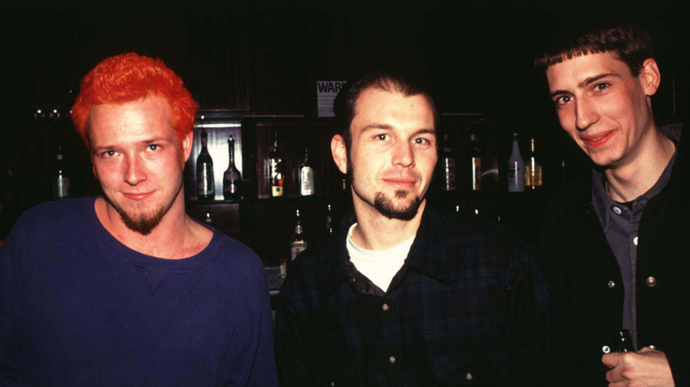 Stone Temple Pilots smirking in a bar