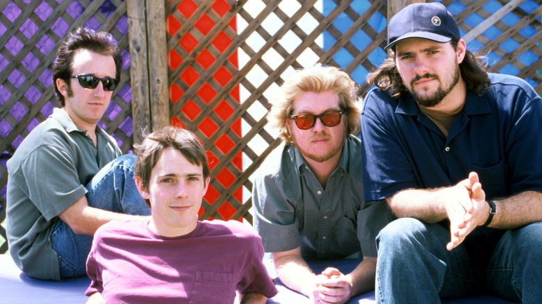 Toad the Wet Sprocket poses in front of lattice