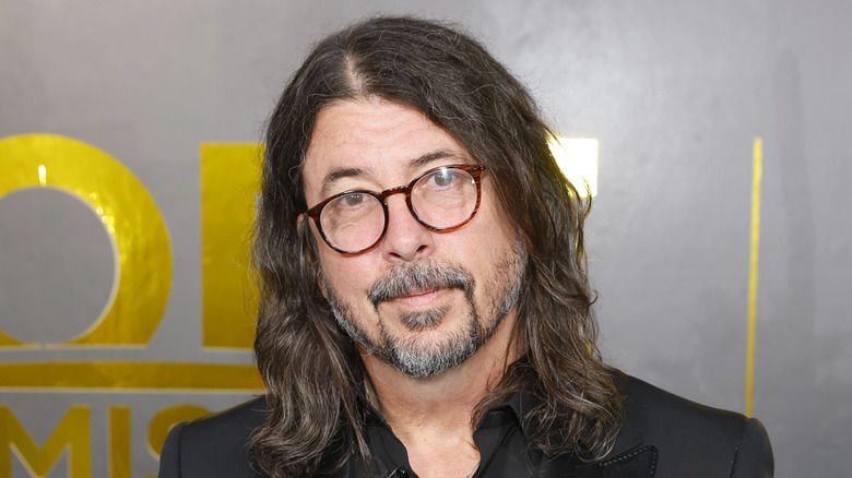 Dave Grohl in glasses cocking head at camera