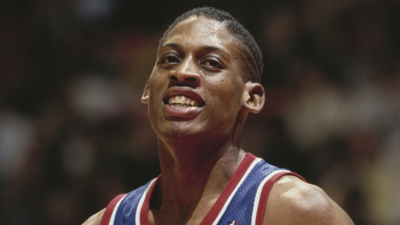 Dennis Rodman smiling in Pistons jersey