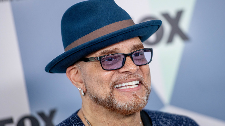 Sinbad smiling in hat in profile