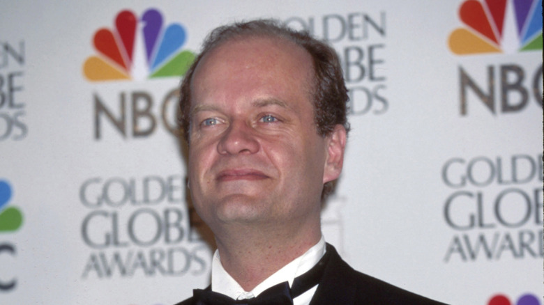 Kelsey Grammer in tux looking out in 1990s