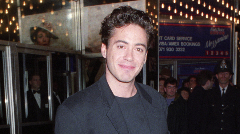 Robert Downey Jr. in '90s looking into camera with closed lips