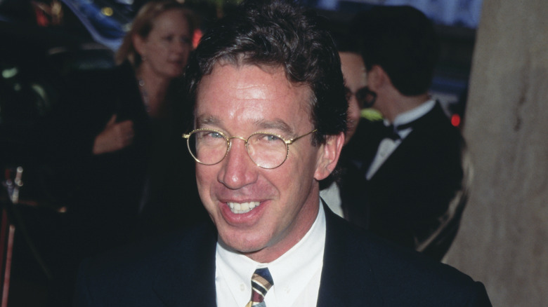 Tim Allen smiling with glasses at '90s event