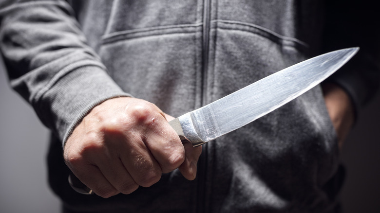 person holding knife