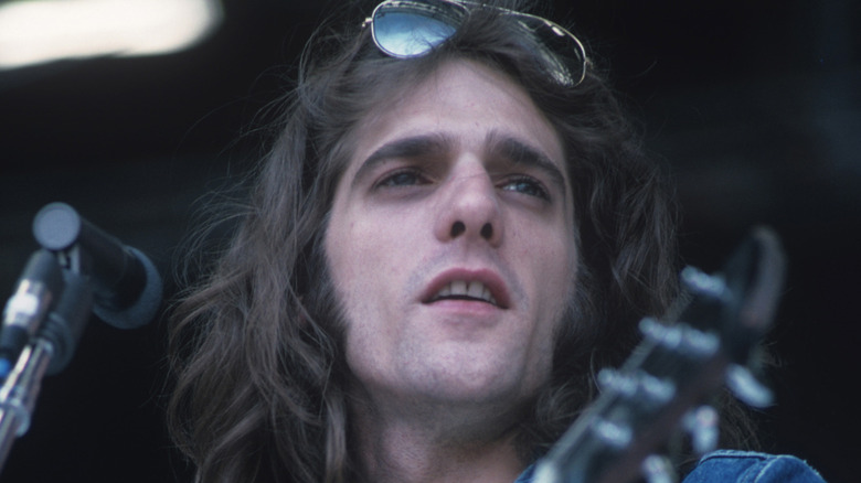 Glenn Frey playing guitar onstage