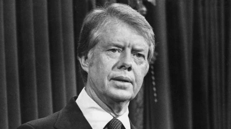 Jimmy Carter speaking at podium