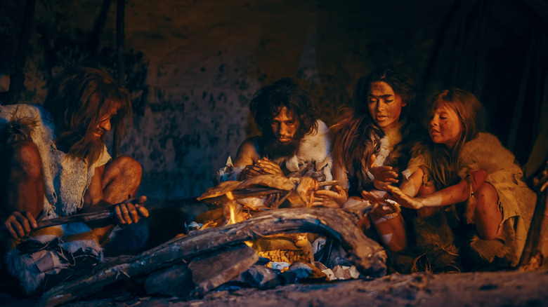 Ancient human family behind fire