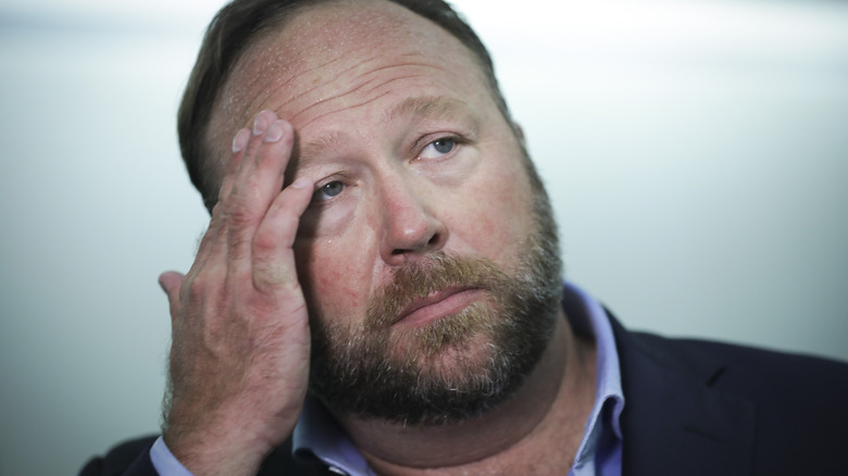 Alex Jones wiping forehead