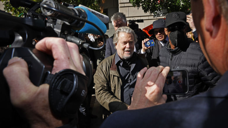 Steve Bannon surrounded by reporters