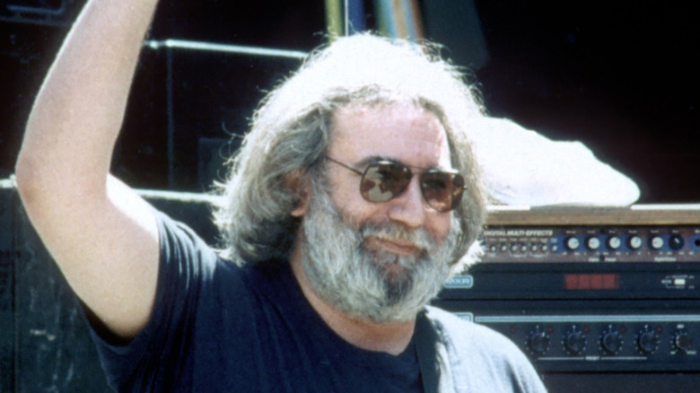 Jerry Garcia waving from stage