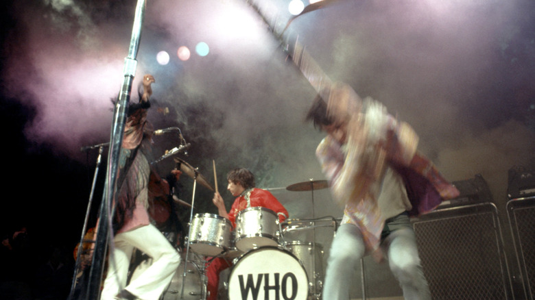 The Who playing on stage and running around