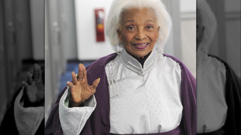 Nichelle Nichols giving the Vulcan salute