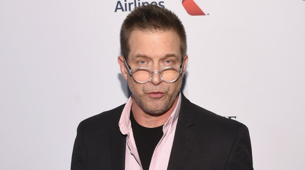 Stephen Baldwin in glasses and suit pouting at event