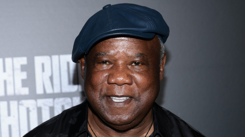 Isiah Whitlock Jr. in leather hat and smiling