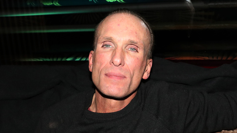 Peter Greene staring solemnly at camera