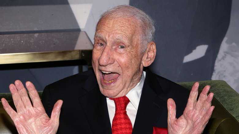 Mel Brooks smiling with hands out