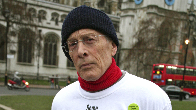 Michael Culver glasses black beanie outside London