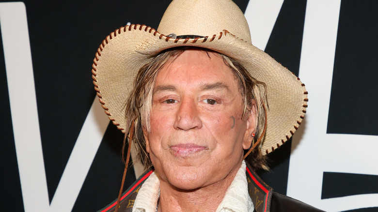 mickey rourke smirking cowboy hat