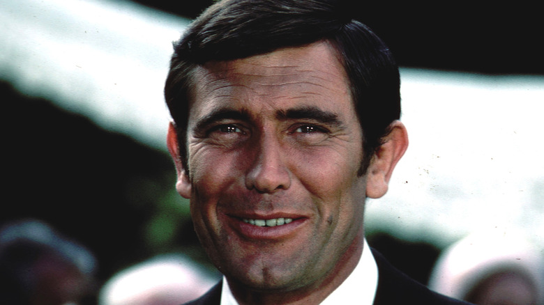 george lazenby '60s smiling at camera