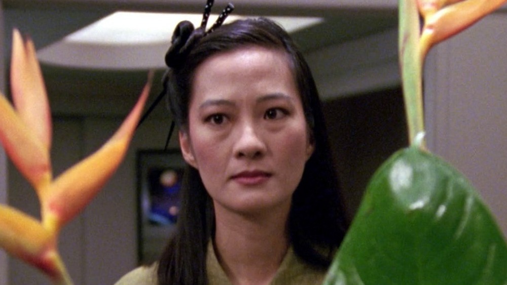 Rosalind Chao behind plant