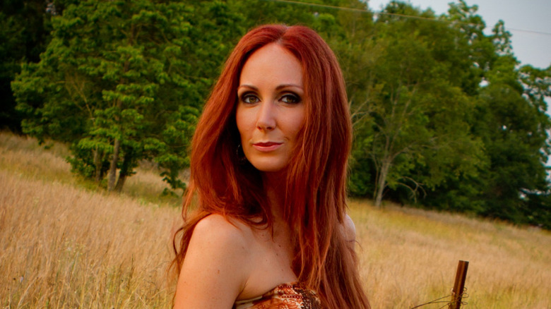 Shannon Richardson posing for photo in a field
