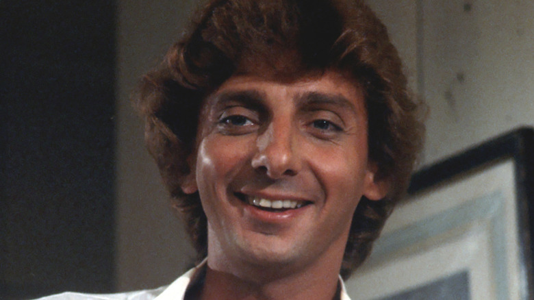 Barry Manilow smiling in white shirt