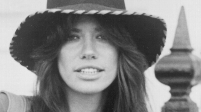 Carly Simon wears a hat