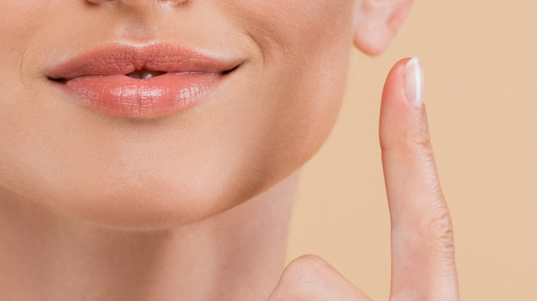 Woman holding sunscreen