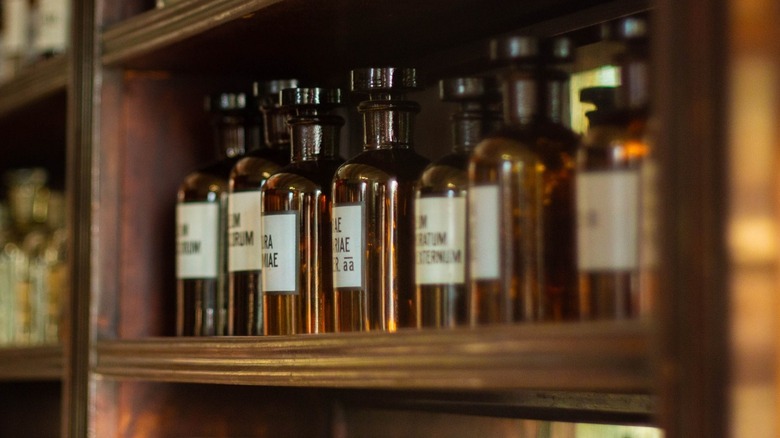 Brown bottles of medicine in a cabinet