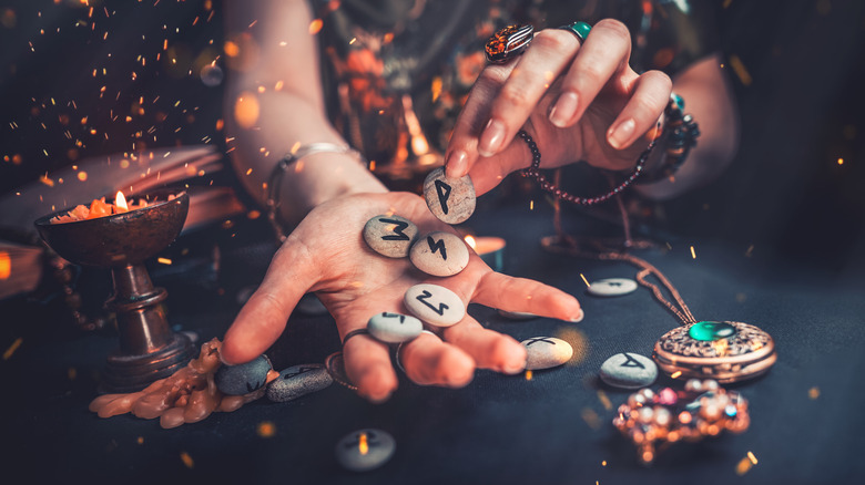 hand holding runestones