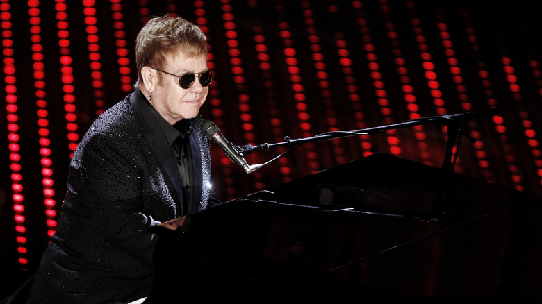 Elton John playing the piano