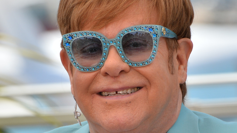 Elton John blue suit sunglasses 