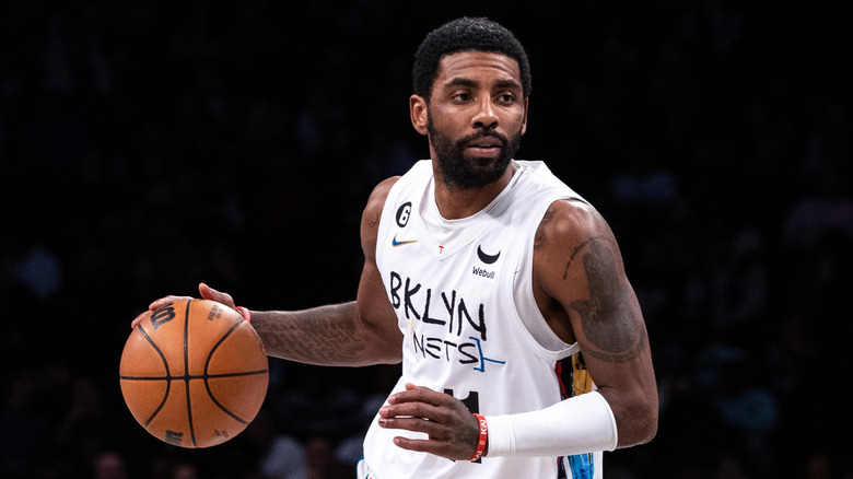 Kyrie Irving dribbles the ball