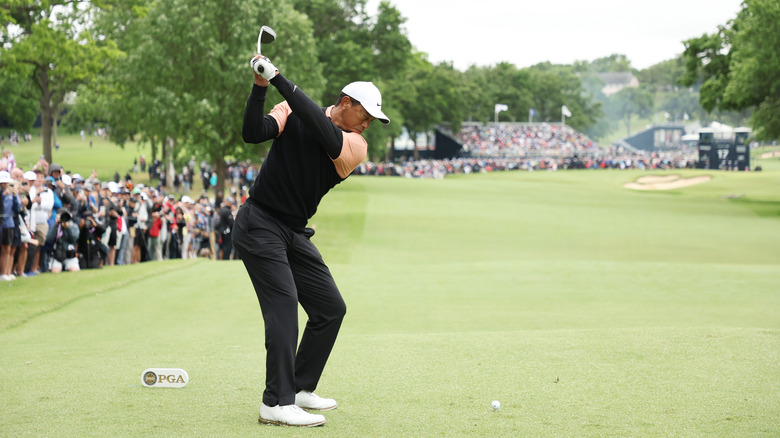 Tiger Woods swinging golf club