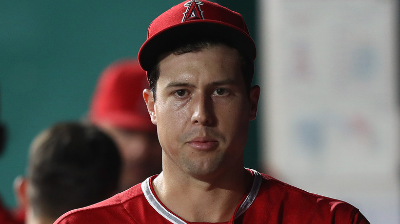 tyler skaggs red cap and shirt staring forward